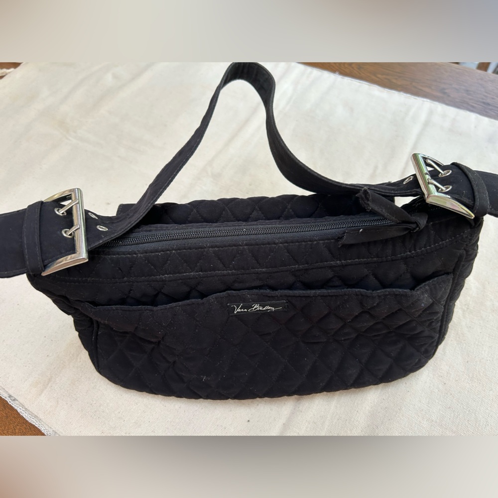 Black quilted Vera Bradley shoulder bag. Silver buckles@ side. Magnetic closure.